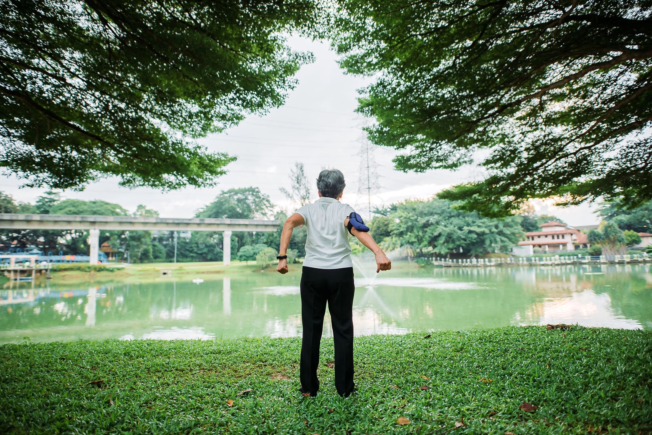 Healthy active adult stretching outdoors for longevity and recovery