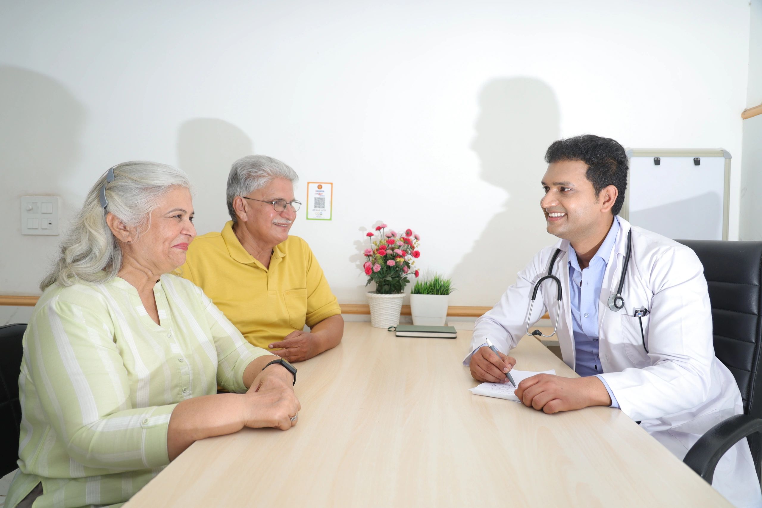 Doctor meeting with patients during a personalized wellness consultation