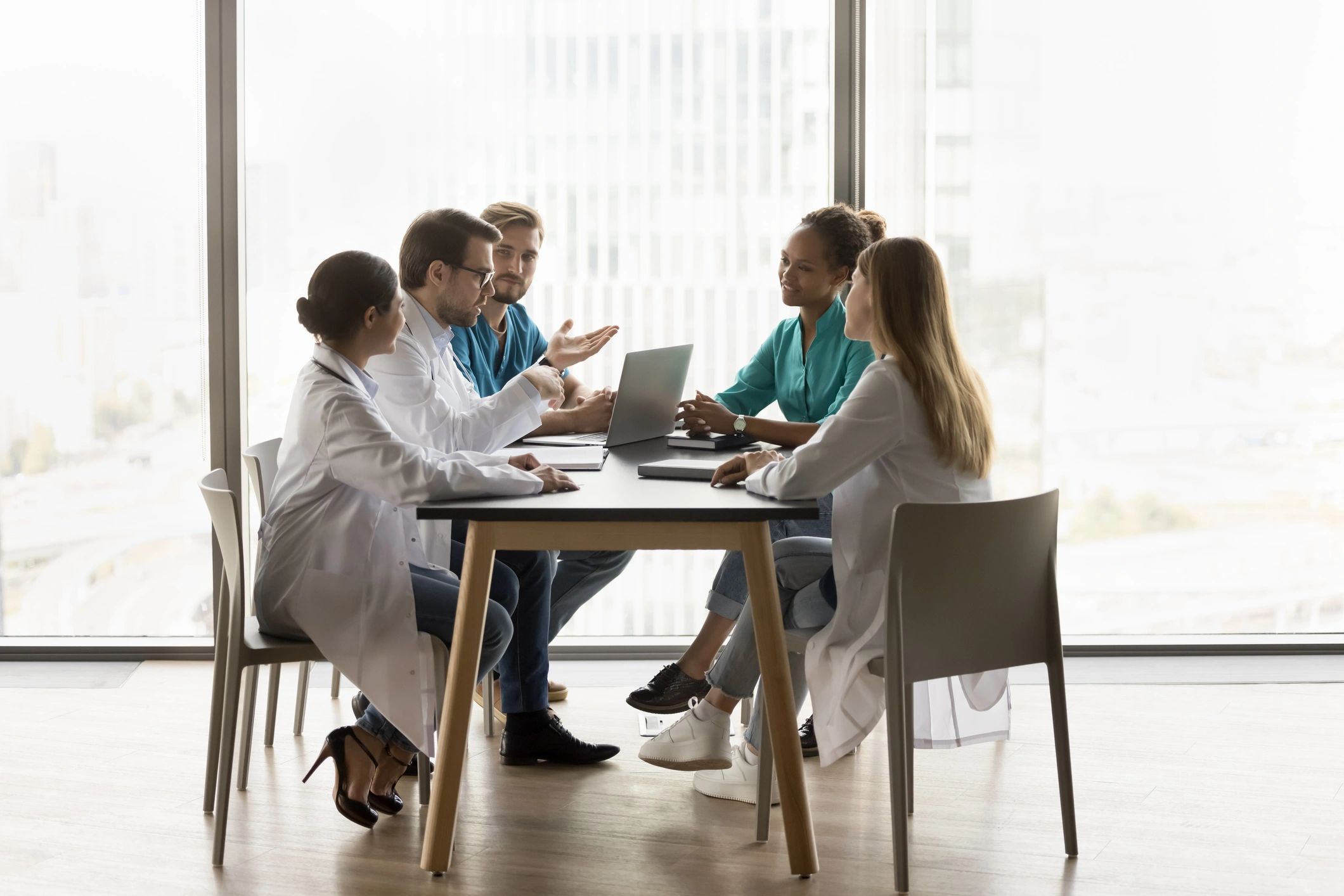 Medical team collaborating in a modern clinic meeting room