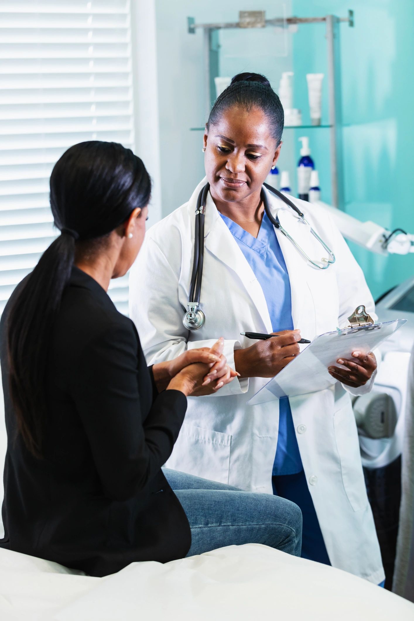 Dermatologist consulting with patient in a clinical setting